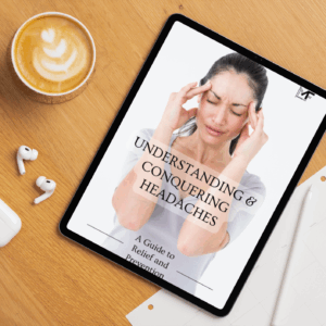 Understanding and Conquering Headaches e-book on a tablet, placed on a table.
